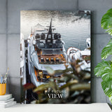 Motivational canvas print with a luxury yacht in a marina and the text “My Future View” on a concrete wall above a side table