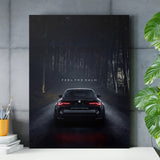 Motivational canvas print with a night BMW on a forest road in a modern home office, automotive lifestyle