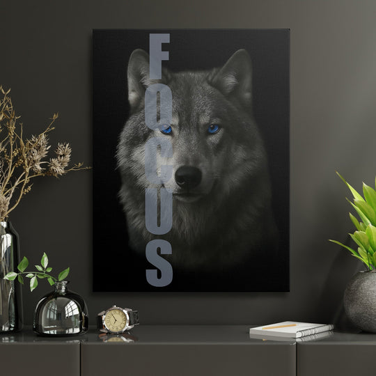 Motivational wall art with a realistic blue-eyed wolf and FOCUS text in a modern office.