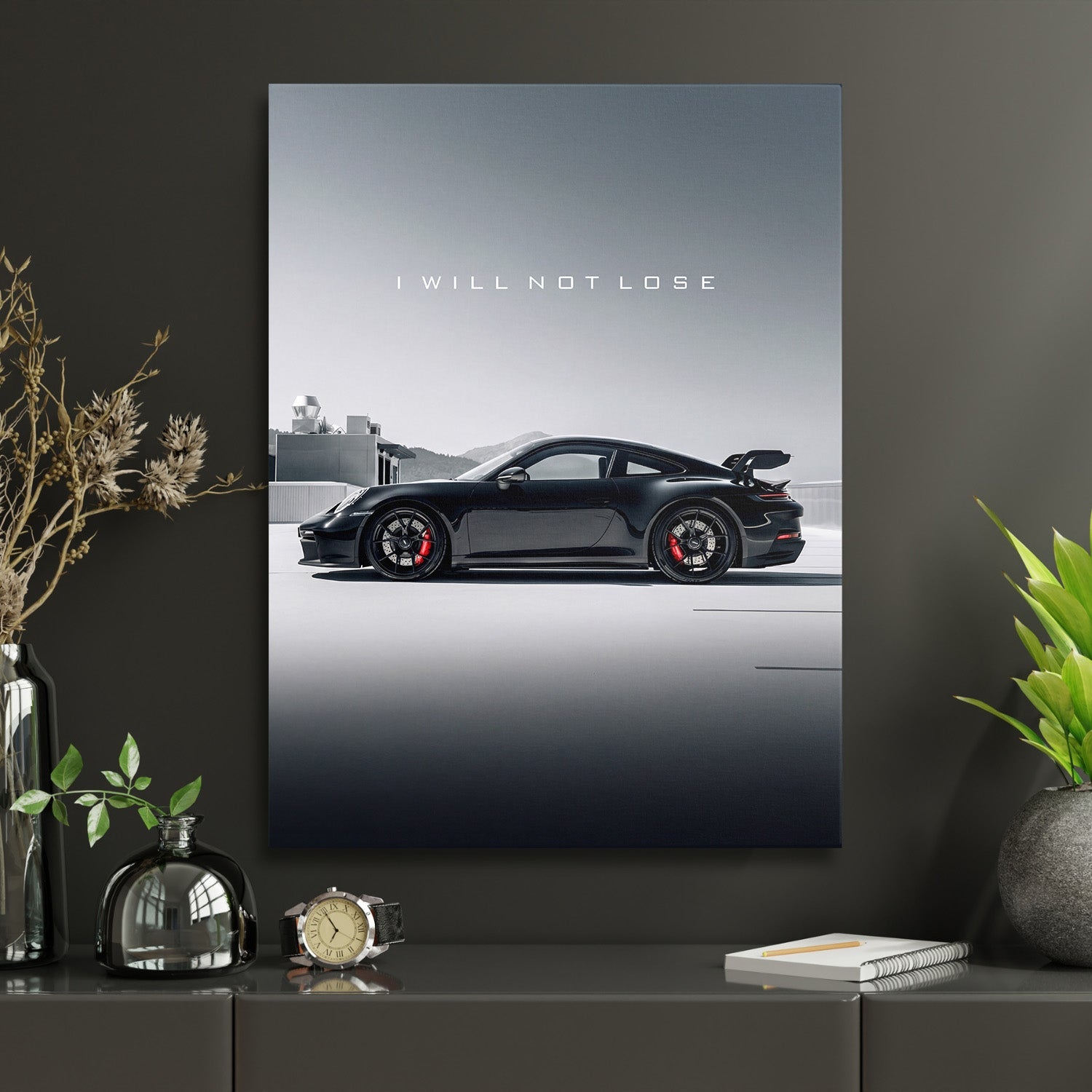 Motivational canvas wall art with black luxury sports car and white text I WILL NOT LOSE in a home office