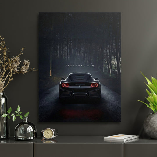 Motivational wall art with black sports car on forest road and quote Feel the calm in a modern living room