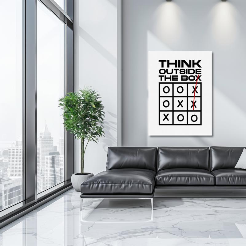 Motivational wall art with “Think Outside the Box” quote and tic-tac-toe motif in a minimalist modern interior.