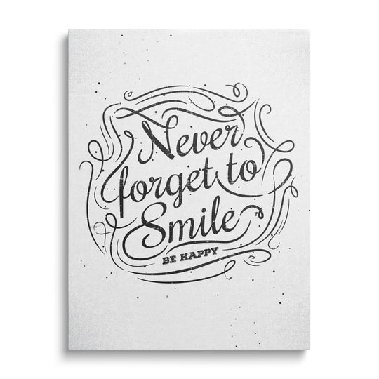 Motivational canvas print with the black-and-white quote “Never forget to smile – be happy” in a minimalist design