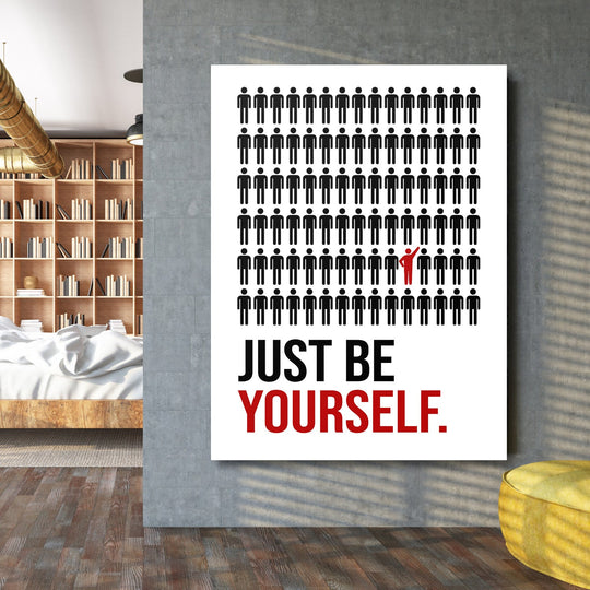Motivational wall art in a living room with black silhouettes and a red figure above the “Just be yourself” text