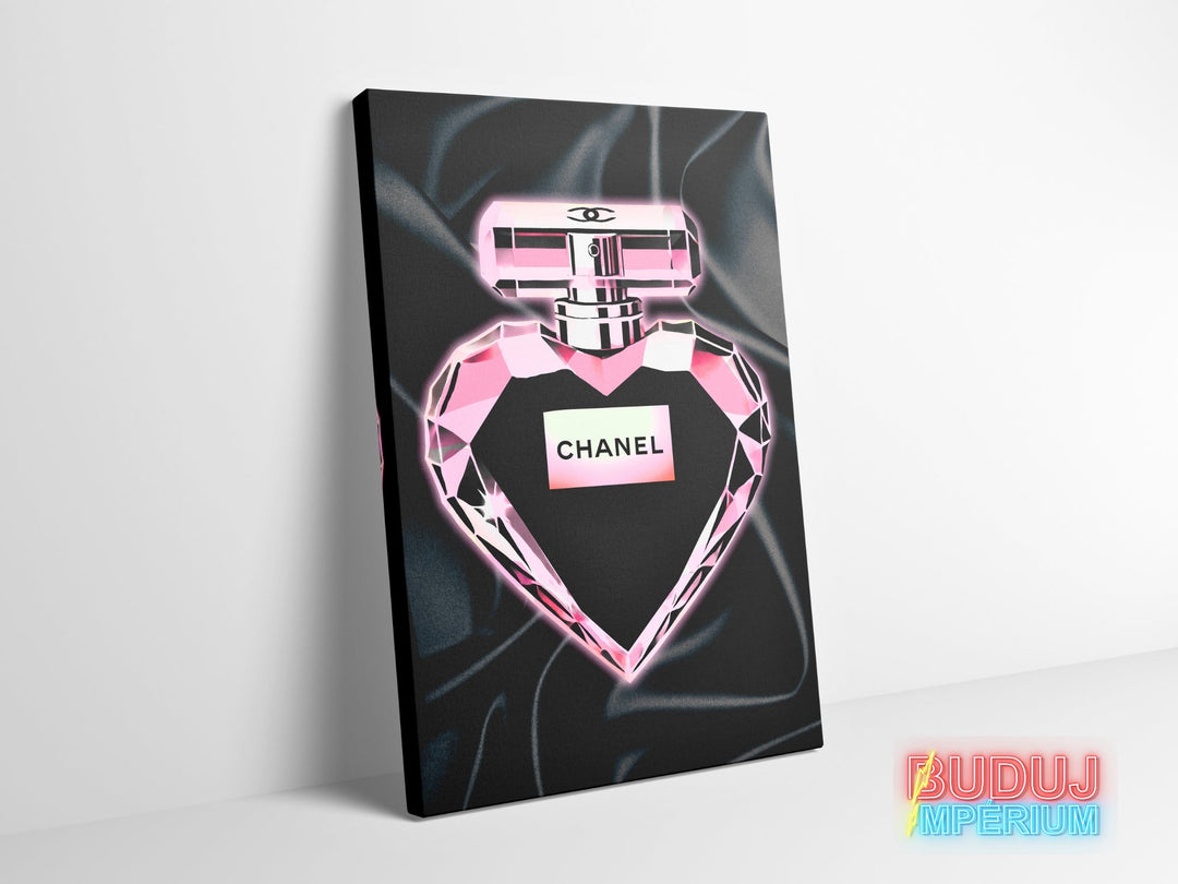 Luxury canvas wall art with pink perfume in a crystal bottle on black satin.