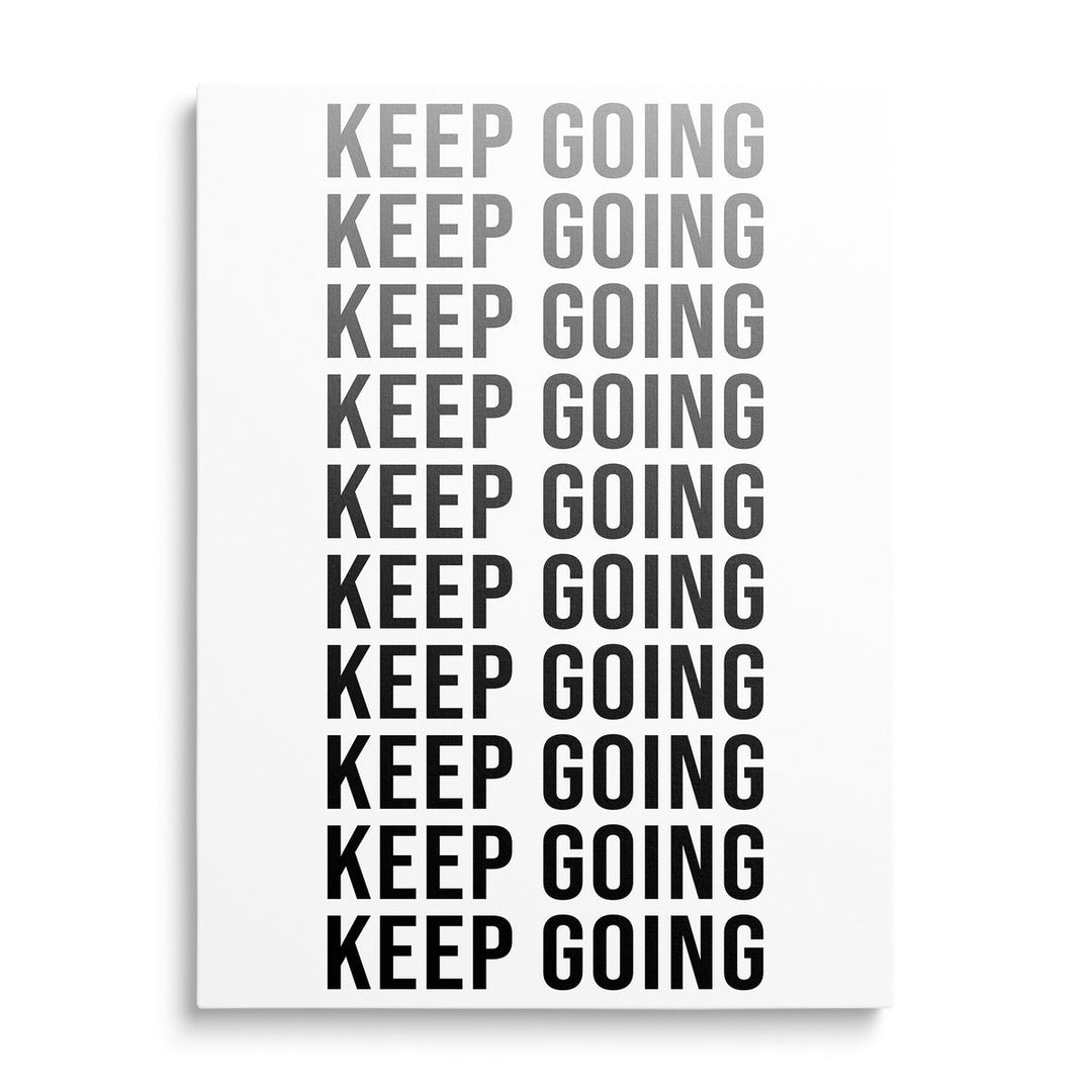 KEEP GOING motivational canvas print with repeated black and white typography in a minimalist design