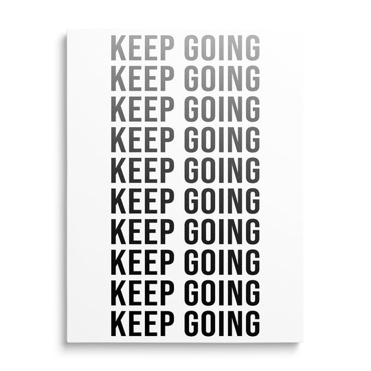 KEEP GOING motivational canvas print with repeated black and white typography in a minimalist design