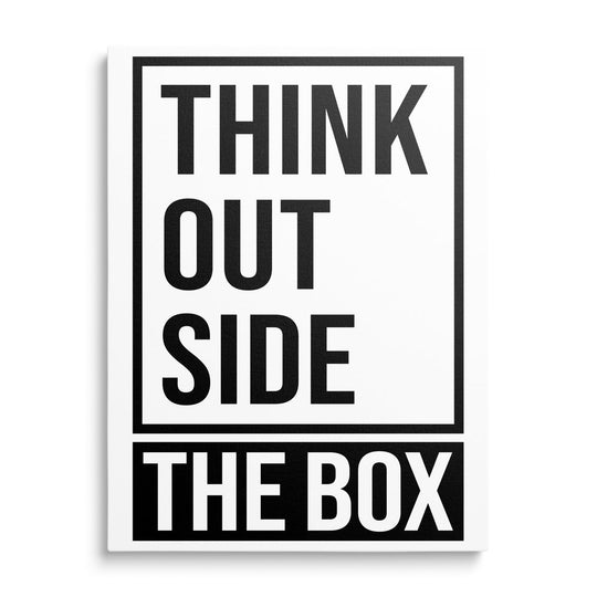 Front view of a motivational canvas print with a black and white minimalist “THINK OUTSIDE THE BOX” inscription