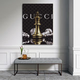 Luxury wall art with a golden chess king and Gucci-style patterned background in an elegant interior.