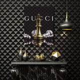Luxury canvas wall art with a golden chess queen and defeated pieces in a black and gold interior.