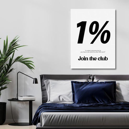 1% motivational canvas wall art with “Join the Club” text, a black-and-white typography print above a bed in a modern bedroom.