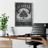 Office motivational wall art with black and white minimalist spade graphic and quote in a lifestyle interior.