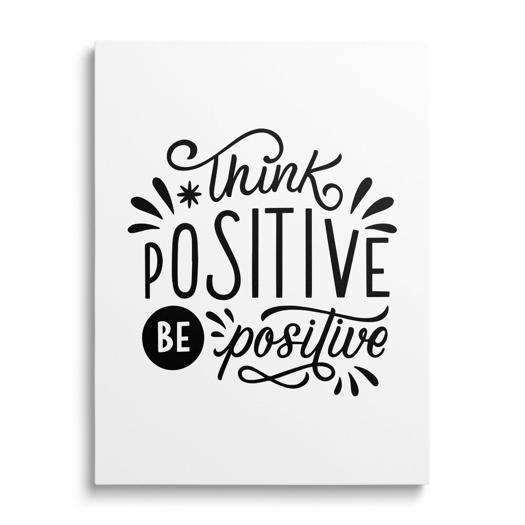 Motivational wall art with the black-and-white calligraphy quote “Think positive be positive”, front view