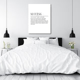 Motivational canvas print above a bed with a minimalist black-and-white SUCCESS quote in a modern bedroom