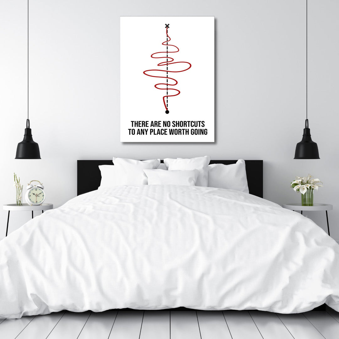 Motivational canvas print for a bedroom with a black-and-white quote and red spiral in a minimalist design