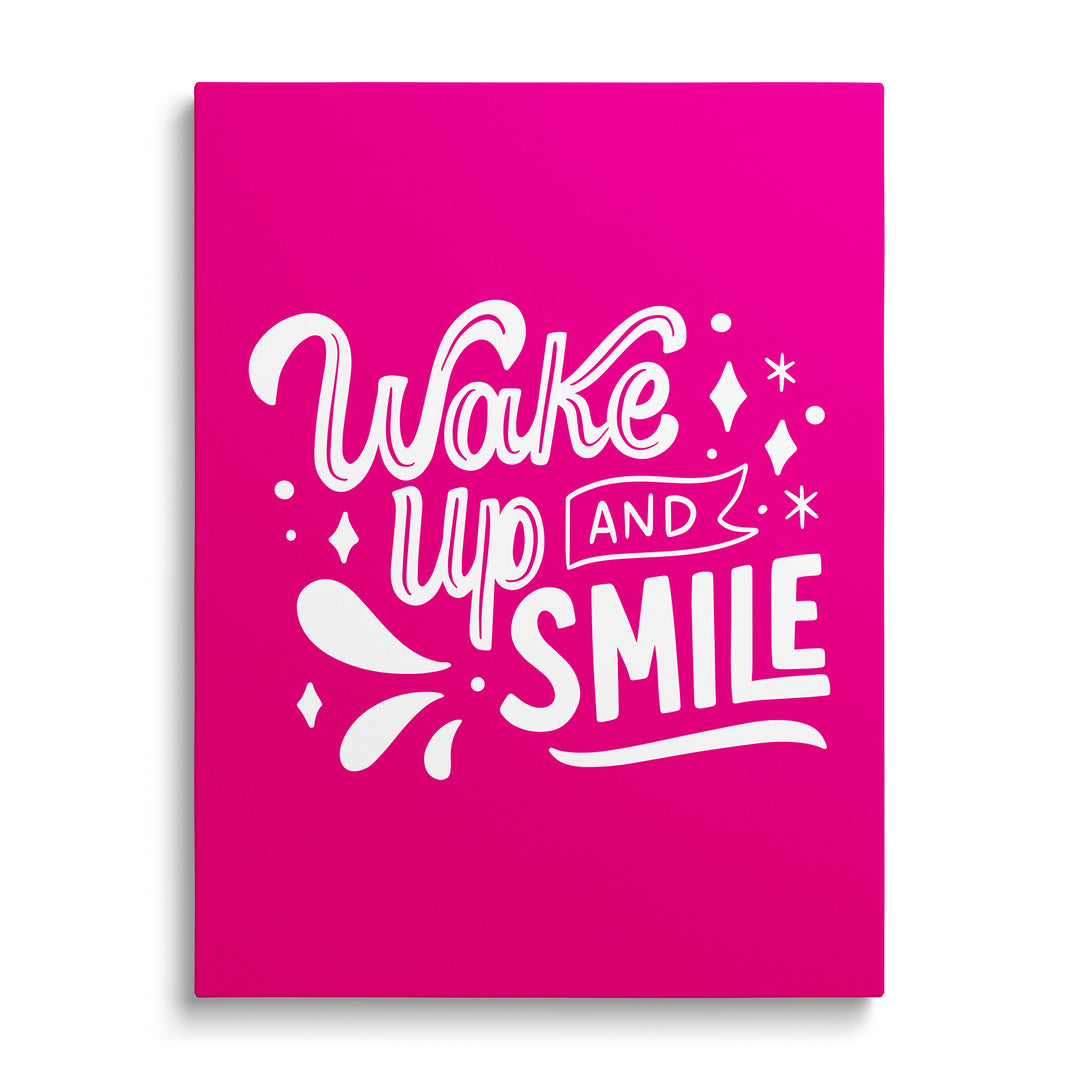 Motivational canvas print with the phrase “Wake up and smile” on a pink background in a minimalist style