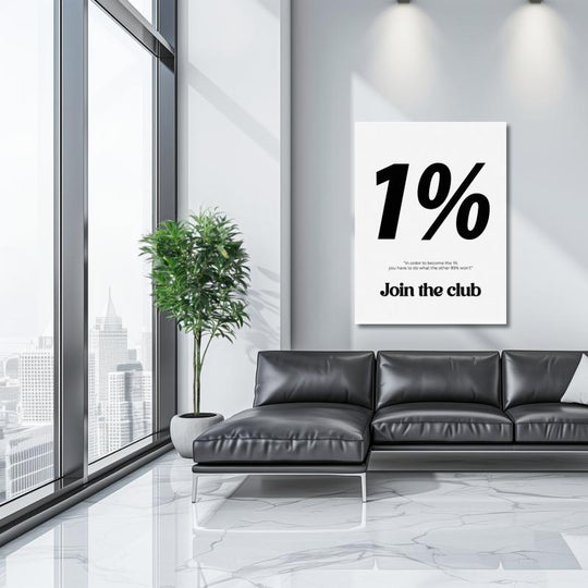 Motivational wall art with the black-and-white quote “1% Join the Club” in a modern luxury living room with a black sofa.