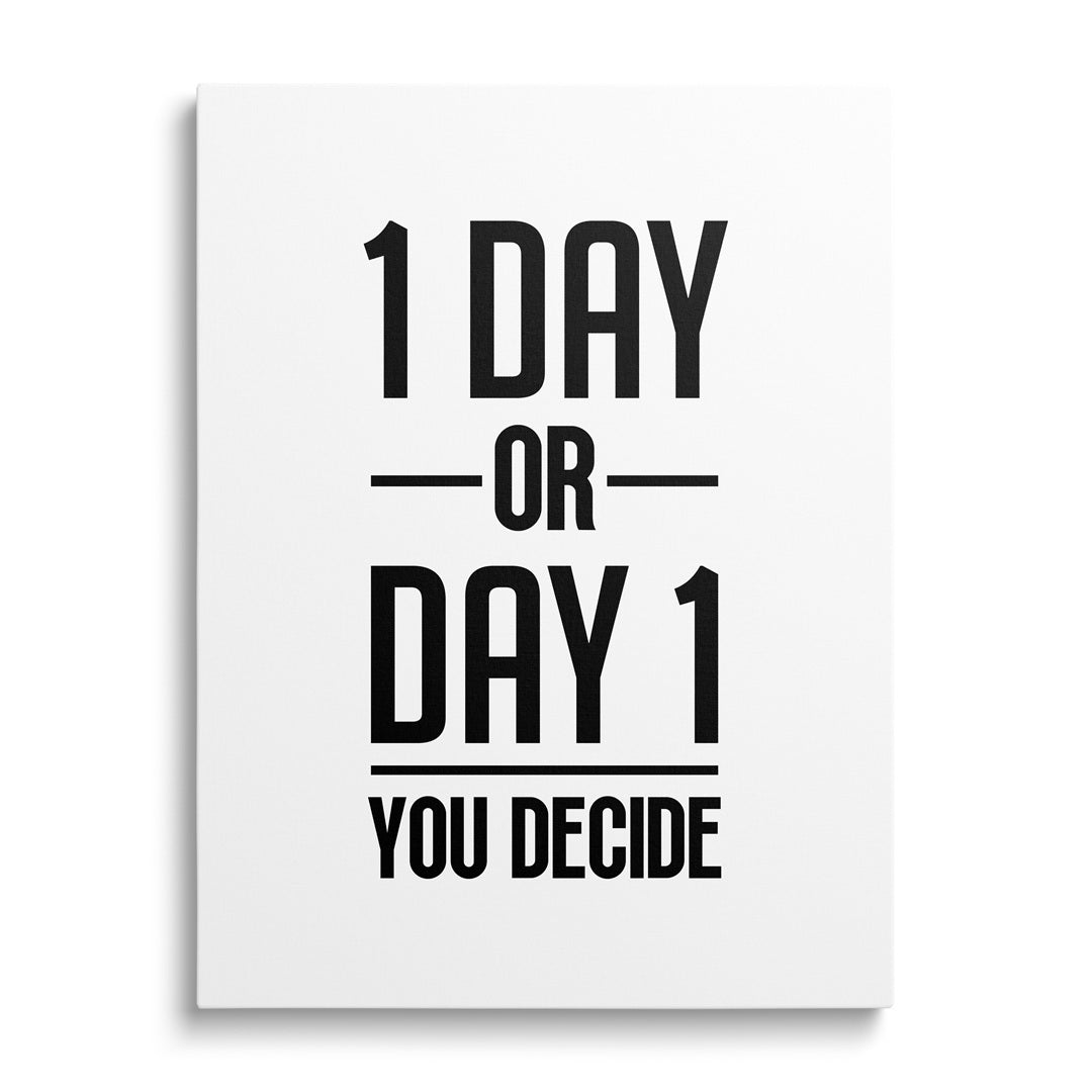 Motivational wall art with the black-and-white quote “1 DAY OR DAY 1 YOU DECIDE.”