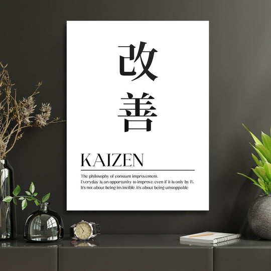Kaizen motivational canvas print with Japanese characters and an English quote on a dark interior wall
