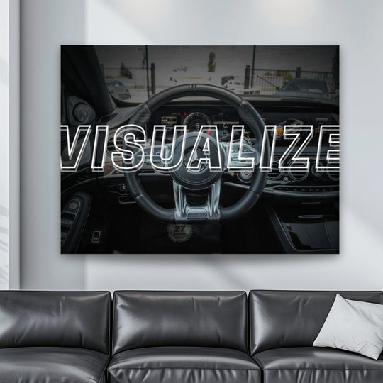 Modern room with motivational wall art featuring a Mercedes AMG steering wheel and English “Visualize” text, a success visualization print by Mindset Walls.